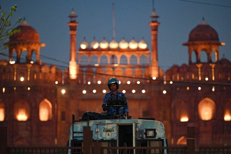 A Rapid Action Force (RAF) personnel stands guard infront of the Red Fort during a protest march by India's Congress party against conviction of Congress party leader Rahul Gandhi in a criminal defamation case, in New Delhi on March 28, 2023. (Photo by Arun SANKAR / AFP)