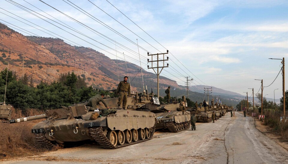 A column of Israeli Merkava battle tanks is amassed in the upper Galilee in northern Israel near the border with Lebanon on October 11, 2023. (Photo by Jalaa MAREY / AFP) A column of Israeli Merkava battle tanks is amassed in the upper Galilee in northern Israel near the border with Lebanon on October 11, 2023. (Photo by Jalaa MAREY / AFP)