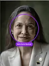 Portrait of Maria Corina Machado in a white blazer with lapel pins and a purple highlighted circle.